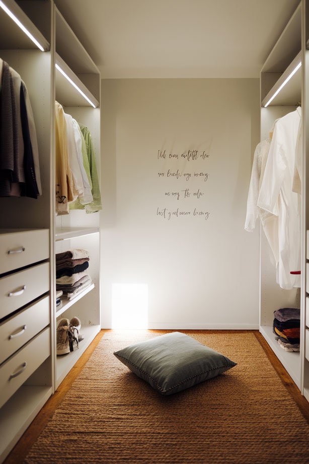 Simple prayer closet with single cushion and inspirational quote