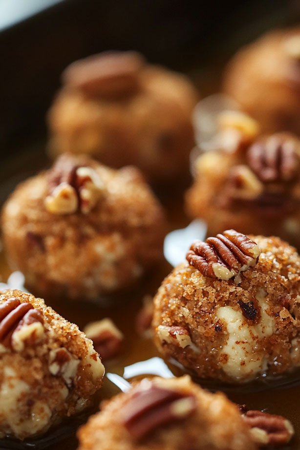 Candied pecan blue cheese balls with cinnamon stick garnish